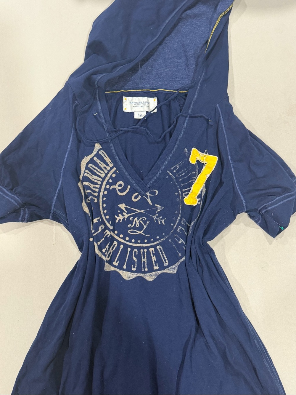 American Eagle Outfitters Navy Hooded Tee with Yellow '7' Patch
